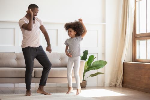 A father and daughter dancing